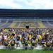 Michigan football fans flood the field for autographs during youth day at Michigan Stadium on Sunday, August 11, 2013. Melanie Maxwell | AnnArbor.com
